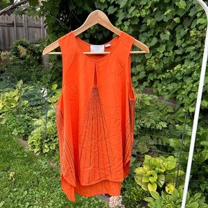 Orange beaded, flowy tank from Anthropologie.